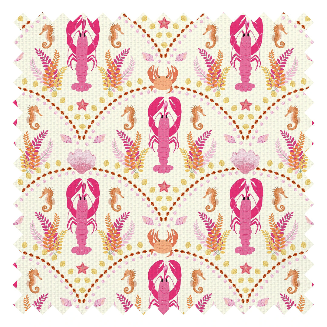 She's our Lobster Fabric in Pink and Orange on Cream