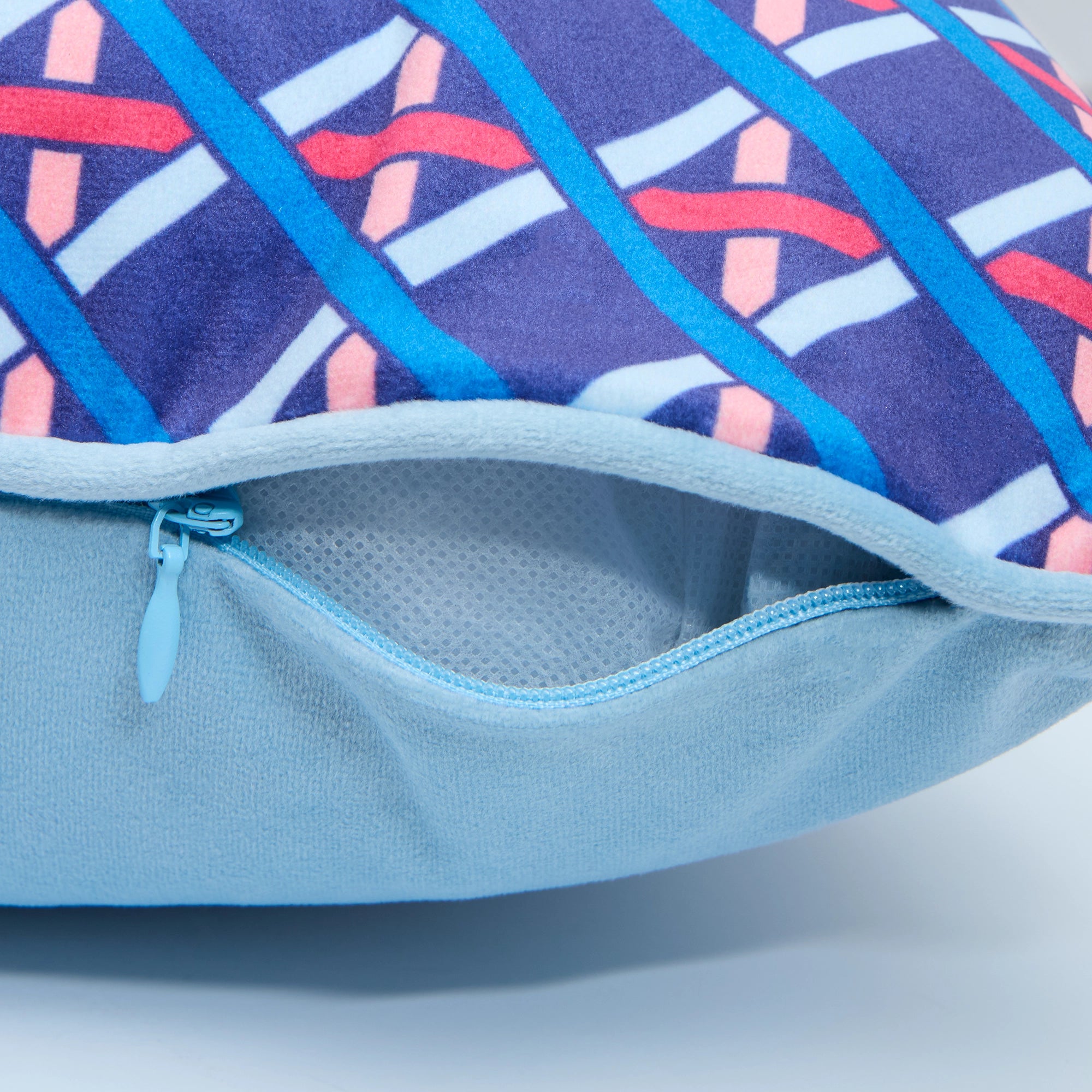 Criss Crossed Bolster Cushion in Electric Blue, Red and Orange