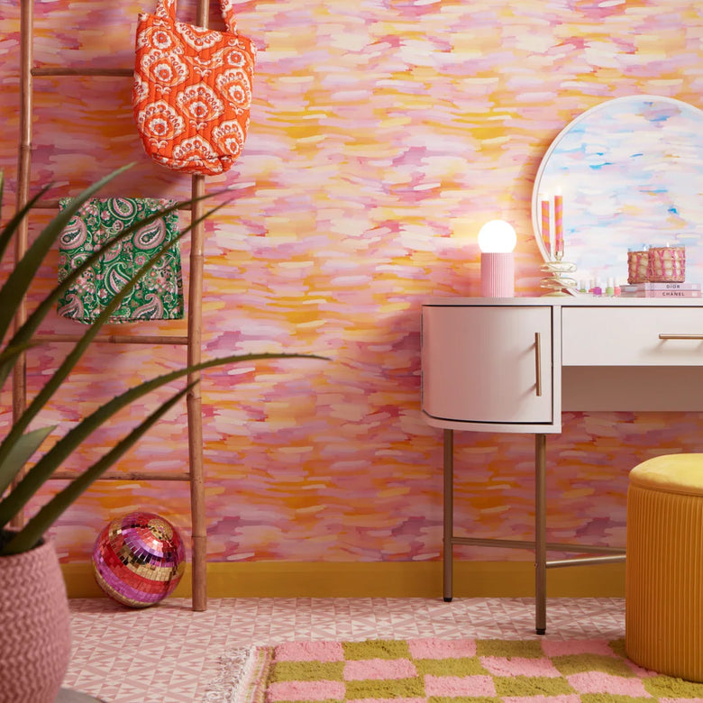 Roomset of brushstroke wallpaper in vibrant pink, orange and yellow colourway 