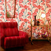 Roomset of matisse pattern wallpaper in peach, chilli and seaweed green colourway 