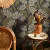 Roomset close-up of matisse pattern wallpaper in walnut and wasabi green on teal colourway 