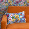 She's a Wildflower Bolster Cushion in Brights on Blue