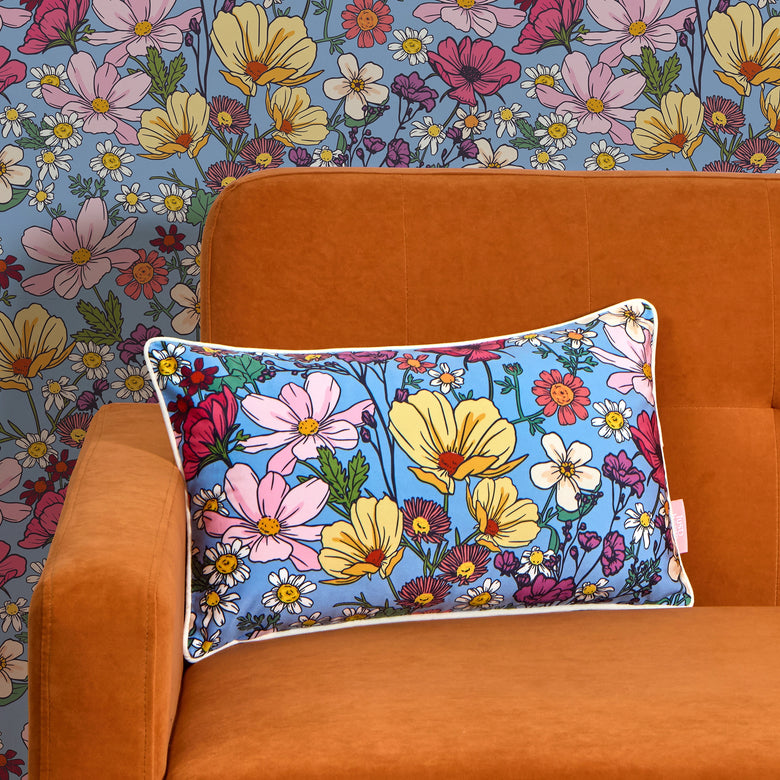 She's a Wildflower Bolster Cushion in Brights on Blue