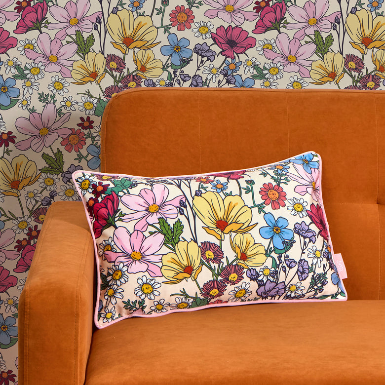 She's a Wildflower Bolster Cushion in Brights on Vintage Cream