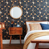 bedroom with navy and gold fertility wallpaper