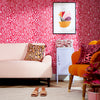 Pink leopard print living room wallpaper with leopard print cushion