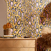Leopard print dining room wallpaper in ochre and pink