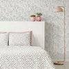 bedroom with feminine line art wallpaper